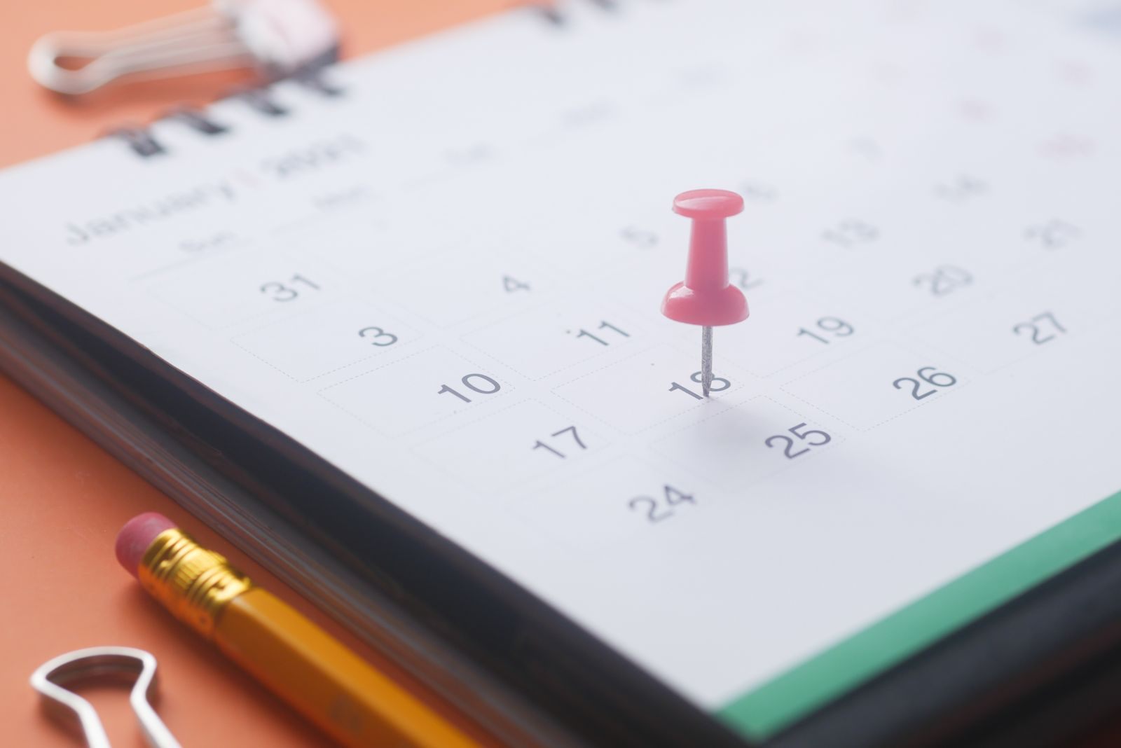 Red pin marking a date on a calendar, planning discount cruises 2027